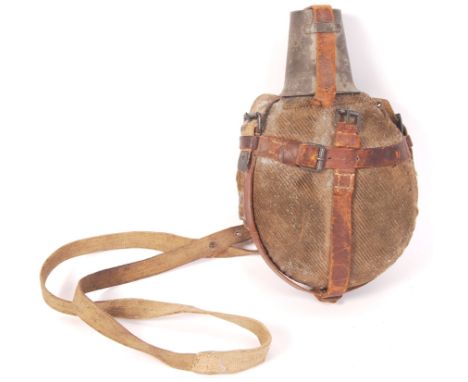 A rare WWI First World War German soldier's / infantry water bottle. Complete with original tan canvas covering, with leather