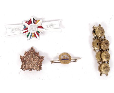 A collection of assorted WWI First World War &amp; WWII Second World War and other military related badges and buttons to inc