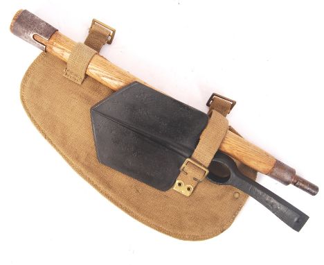 A WWII Second World War British entrenching tool / pickaxe. Appears ex-stores as unused. The pick-axe marked for ' Hillington
