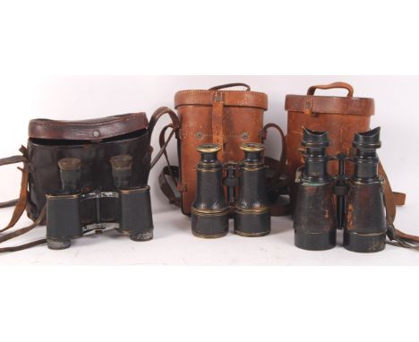 A collection of 3x pairs of WWI First World War related binoculars. All in their original leather cases. Comprising: a pair o