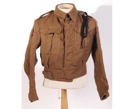 A rare WWII Second World War 185th Infantry Brigade battledress uniform tunic / blouse. 185th Infantry patches to sleeves, co
