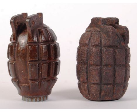 An original WWI First World War Mills Bomb / hand grenade ' Mk 1 ' along with a later relic Mill's bomb grenade. Both inert. 