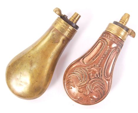 Two antique 19th century copper / brass powder shot flasks. The first in copper, with decorative motif, the other in brass. B