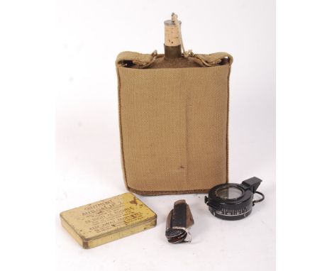 A collection of assorted WWI &amp; WWII Militaria. Comprising: a WWI First World War pen knife, a TG Co. Ltd field compass, a