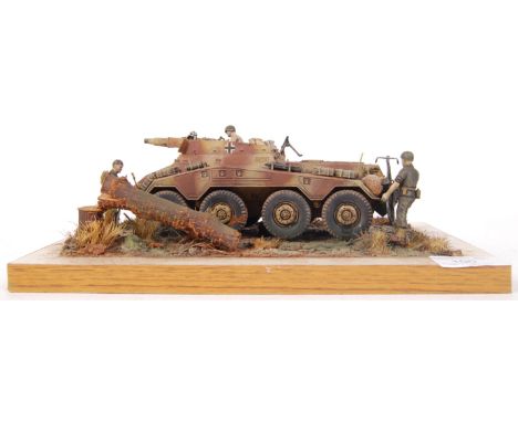 A superb museum quality military model diorama. Showing an armoured military vehicle. The model being superbly detailed with 