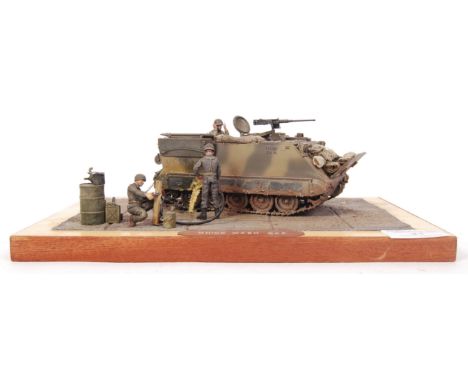 A superb museum quality military model diorama. Showing an armoured military vehicle, titled ' Quick Wash Off '. The model be