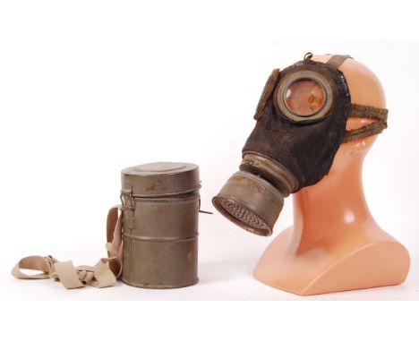 A rare WWI First World War German infantry soldier's Gas Mask and carry tin. The filter stamped for ' Juli 18 ', so a late-is