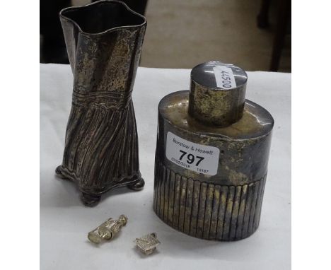 A silver caddy and lid by Goldsmith's & Silversmith's Co., and a twisted silver vase, 6.7 oz. and 2 charms.