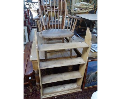 An oak bow arm spindle back elbow chair and a pine hanging shelf.