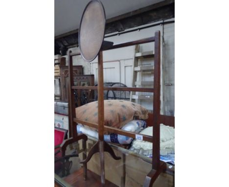 A turned wood table on tripod base and a wooden towel rail.