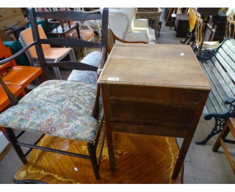 An Antique oak ladder back elbow chair with turned stretchers and legs and an oak sewing cabinet.