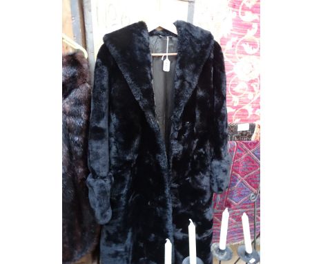 A lady's full length fur coat.