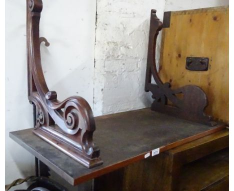 A Victorian mahogany hanging shelf with carved supports, width 2'9".