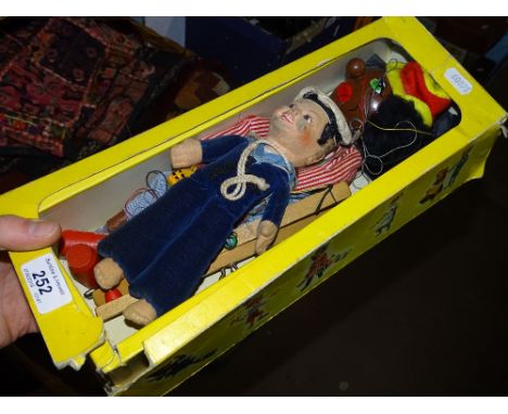 A Norah Wellings sailor doll and a boxed Pelham puppet.