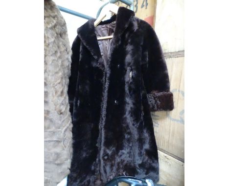 A lady's full length fur coat.