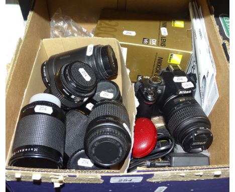 A Nikon camera, various lenses, etc.
