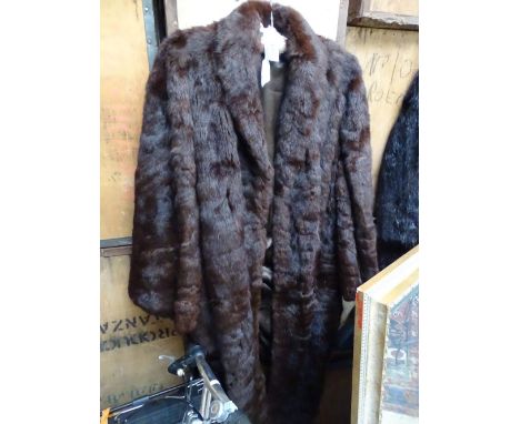A lady's full length fur coat.