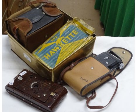 A Kodak Bakelite No. 2 Hawkette camera, and 2 others.
