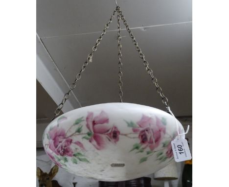 An Art Deco glass ceiling light bowl decorated with roses.