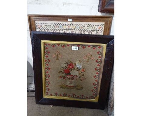 A framed needlework picture depicting a vase of flowers and a sampler, dated 1980, (2).