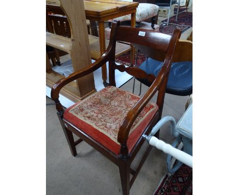 A Georgian mahogany desk chair with upholstered seat.