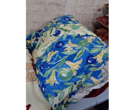 Large pair of multi-coloured blue lined curtains.