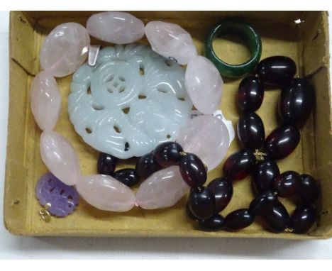 Rose quartz bracelet, a jade pendant, ring, etc