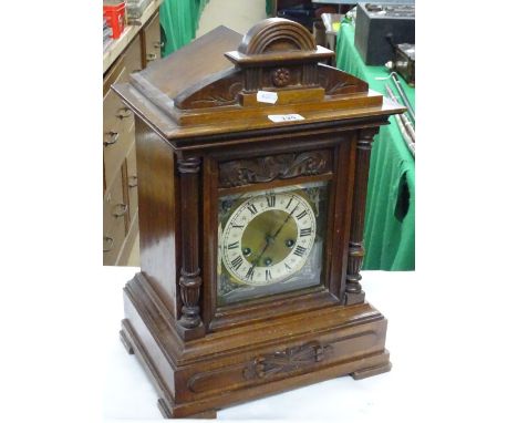 Carved mahogany cased 3-train mantel clock.