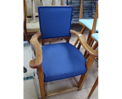 An Arts & Crafts Cacqueteuse armchair with upholstered seat and back.