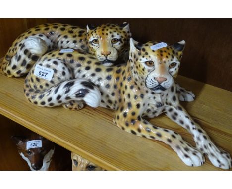 An Italian ceramic group of 2 leopards.