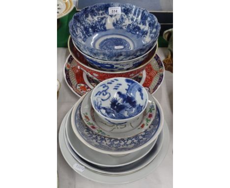 A duck, Oriental bowls and plates.