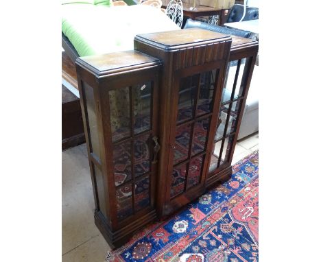 An Art Deco oak breakfront 3-door glazed display cabinet, width 3'4".