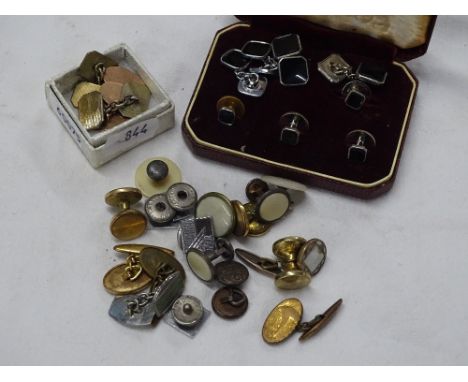 Pair of 9ct gold engraved cufflinks, 4.7g, pair of 9ct gold and silver cufflinks, 6.6g, a cased set of chrome studs and cuffl