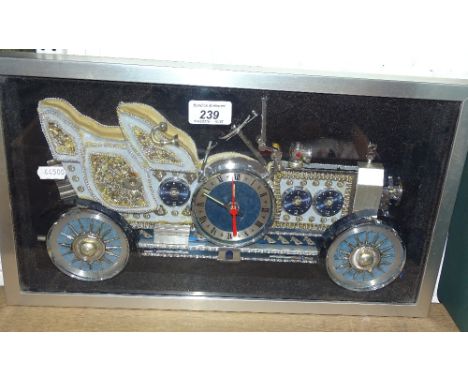 A wall clock in the form of a veteran car.