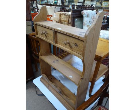 A pine 2-tier hanging shelf with drawers.