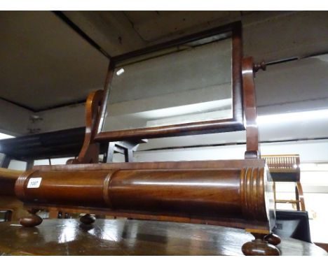A 19th century mahogany swing toilet mirror with barrel turned drawer.