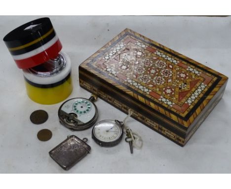 Box with vesta case, watches and a cigarette lighter.
