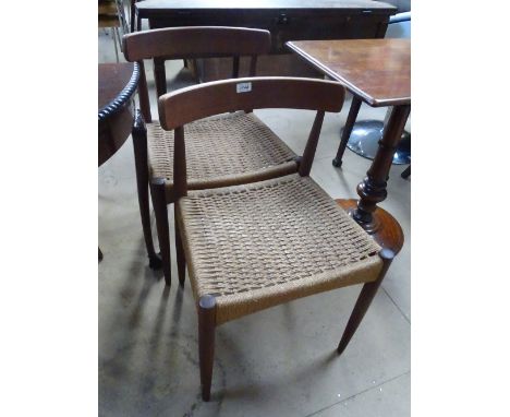 A pair of Danish Arne Hovmand Olsen for Mogens Kold teak dining chairs with original paper cord seat and labels to underside.