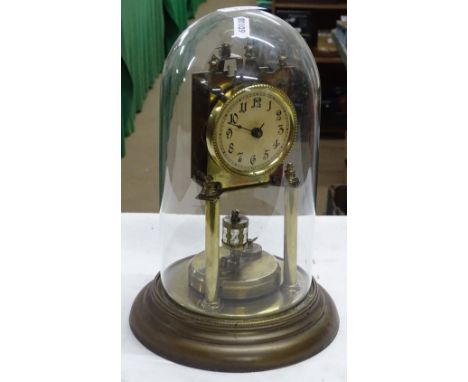 A brass 400-day clock under glass dome.