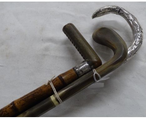 Ornate white metal handled walking stick, sectional horn stick and a horn handled stick, (3).