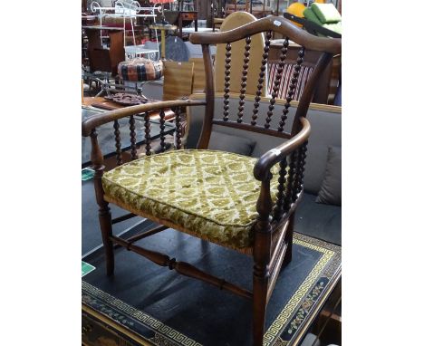 19th century mahogany and bobbin turned nursing chair with cane upholstered seat.