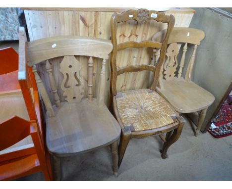 A French oak ladder back chair and a pair of modern pine kitchen chairs.