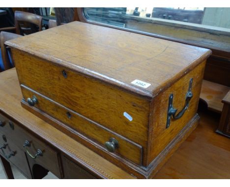 A Victorian oak tool box with fitted drawer and quantity of hand tools.