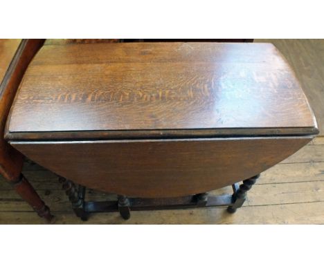 A 1920's Oak barley twist gate leg table