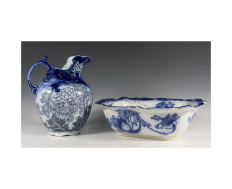In floral blue, featuring a Royal Doulton wash basin with gold leaf accents, and a Doulton Burslem Boleyn pitcher. Marked on 