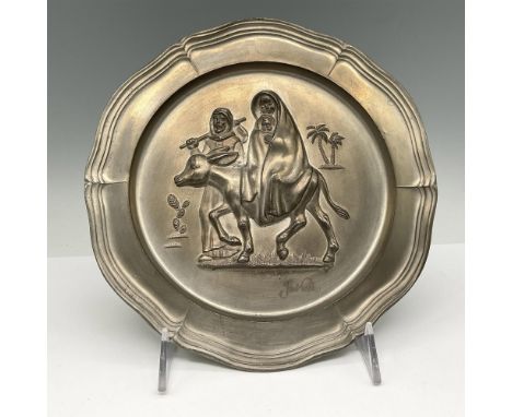 1974 First limited Edition metal plate has a molded design in center with ruffled edge. Artist impressed signature. Goebel im
