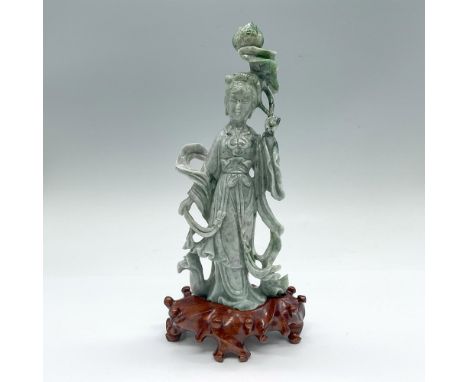 A beautiful light green stone with dark green speckles. Bodhisattva of compassion, holding an unbloomed lotus bud. This item 