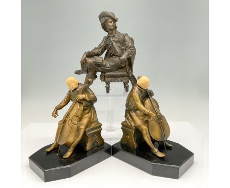 Two sculptures of the cellist on black base - can be used as bookends - impressed J. Ruhl mark. Bronze sculpture of poet sitt