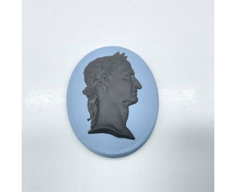 Bust of a Roman emperor, likely Emperor Domitian (reigned 81â€“96 A.D.), crafted in black over the traditional Wedgwood blue 