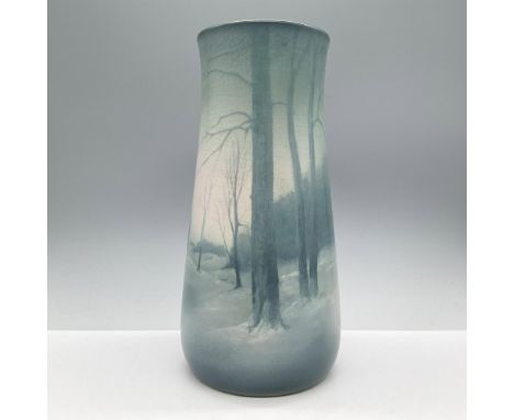 Elegant vase that features a serene and misty winter forest scene, artfully depicted with subtle gradients of blue. Matte gla